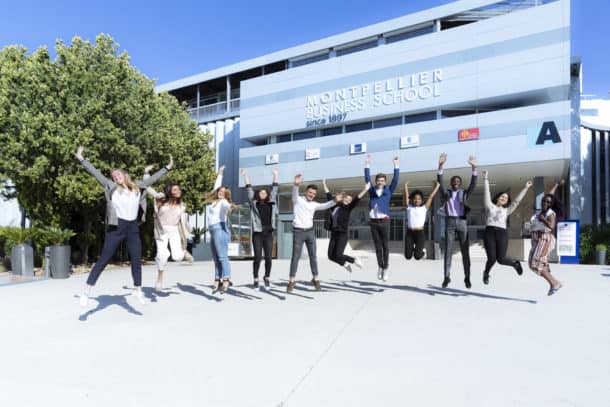 Students jumping outside Montpellier Business School